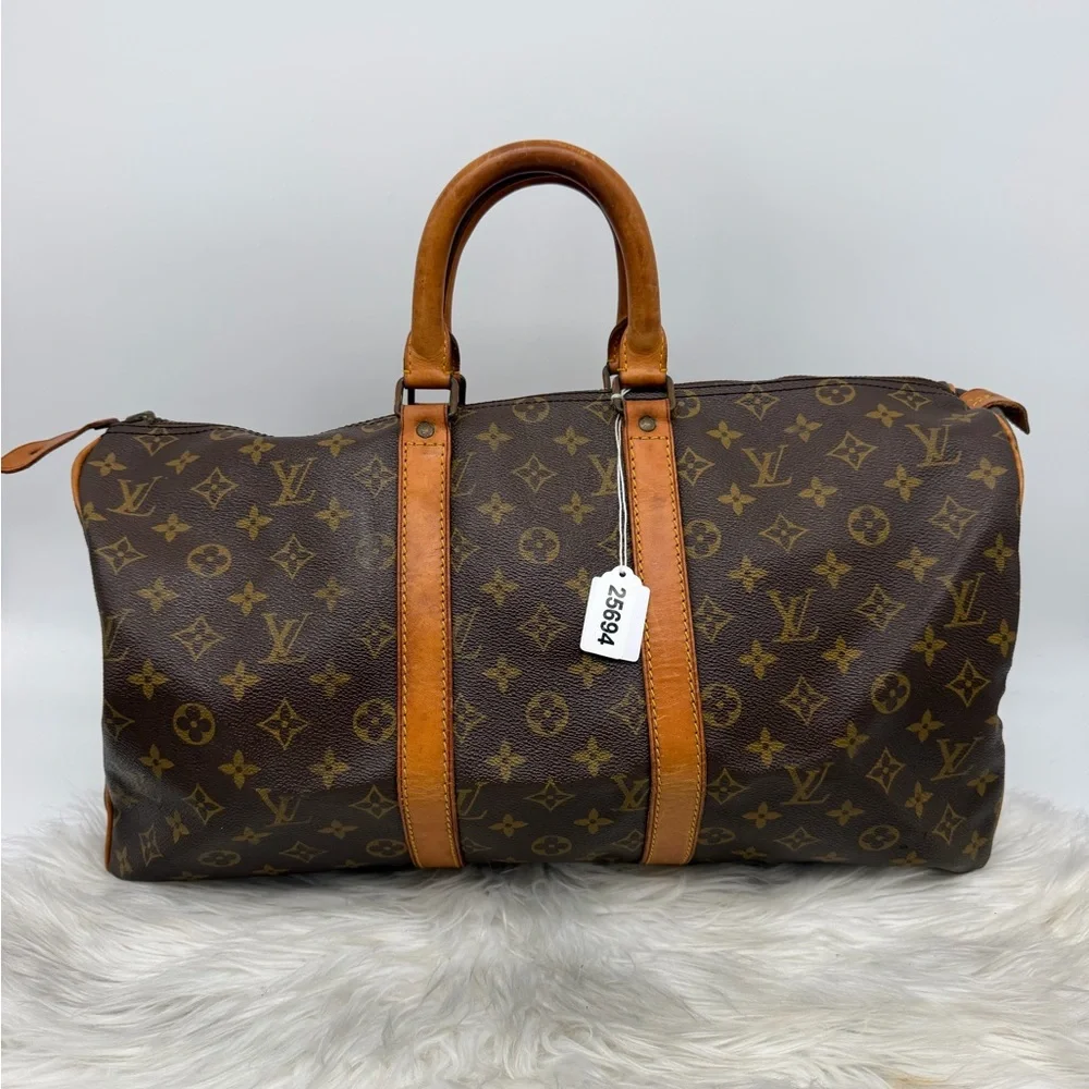 Louis‎ Vuitton Brown Monogram Duffel Bag with Tan Leather Trim